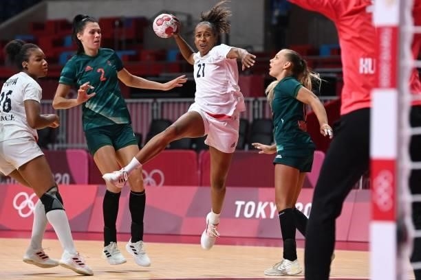 France's left back Estelle Nze Minko shoots during the women's preliminary round group B handball match between Hungary and France of the Tokyo 2020...