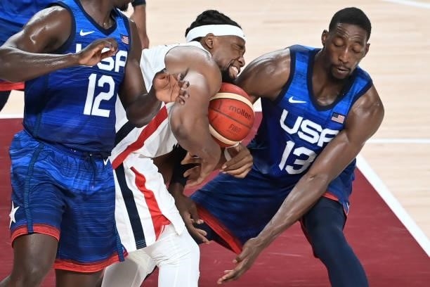 France's Guerschon Yabusele figths for the ball USA's Edrice Femi Adebayo during the men's preliminary round group A basketball match between France...