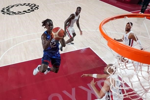 S Jrue Holiday goes for the basket past France's Nicolas Batum during the men's preliminary round group A basketball match between France and USA...