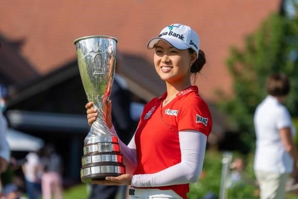 Minjee Lee of Australia celebrates with the trophy after winning the tournament during day four of the The Amundi Evian Championship at Evian Resort...