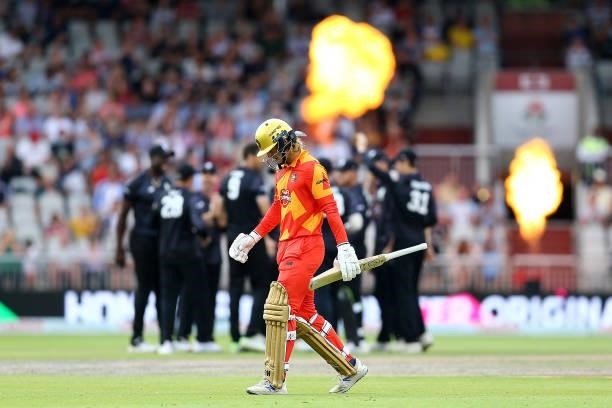 Miles Hammond of Birmingham Phoenix walks off after being dismissed by Steven Finn of Manchester Originals during The Hundred match between...
