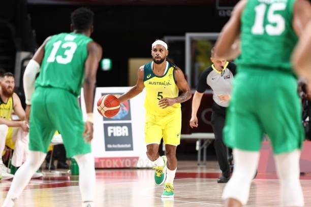 Patty Mills of the Australia Men's National Team dribbles the ball against the Nigeria Men's National Team during the 2020 Tokyo Olympics on July 25,...