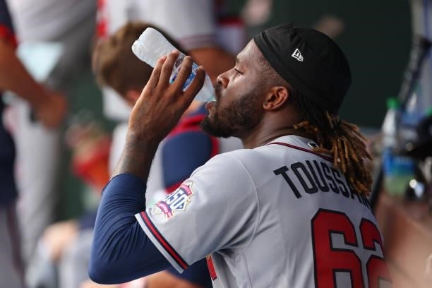 Pitcher Touki Toussaint of the Atlanta Braves drinks a bottle of water between innings during a game against the Philadelphia Phillies at Citizens...