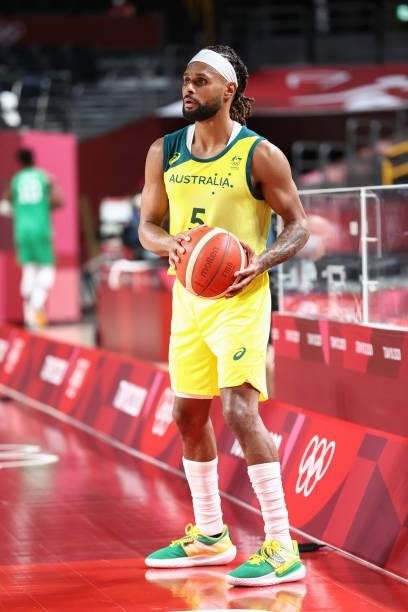 Patty Mills of the Australia Men's National Team looks to pass the ball against the Nigeria Men's National Team during the 2020 Tokyo Olympics on...