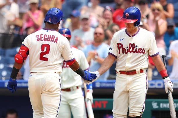 Jean Segura of the Philadelphia Phillies is congratulated by J.T. Realmuto after hitting a home run against the Atlanta Braves during the fourth...