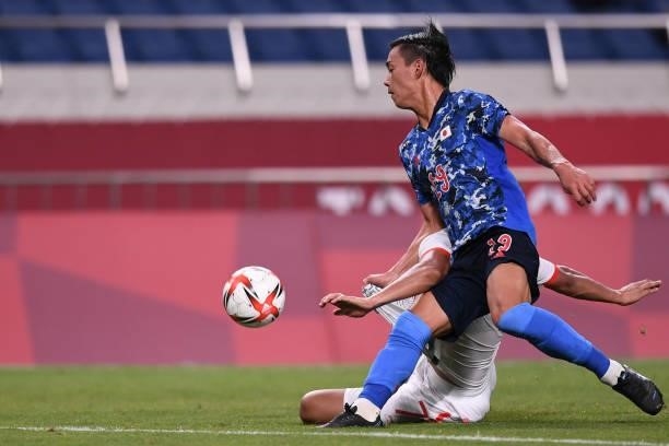Daichi Hayashi of Team Japan dribbles the ball during the Men's First Round Group A match on day two of the Tokyo 2020 Olympic Games at Saitama...