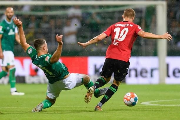 Niclas Fuellkrug of SV Werder Bremen and Sebastian Ernst of Hannover 96 battle for the ball during the Second Bundesliga match between SV Werder...