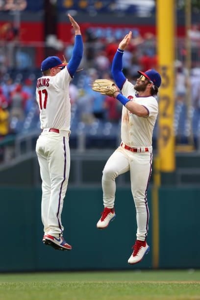 Rhys Hoskins and Bryce Harper of the Philadelphia Phillies celebrate after defeating the Atlanta Braves 2-1 in a game at Citizens Bank Park on July...