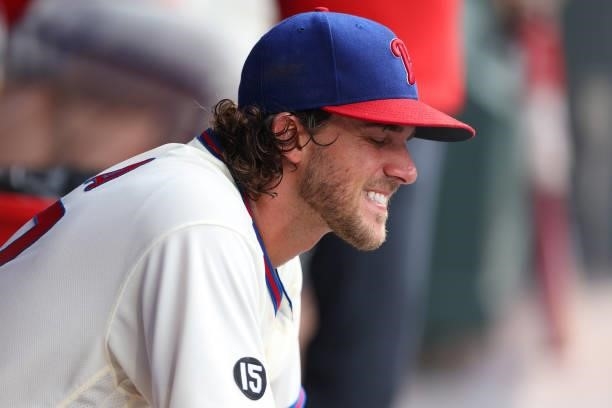 Pitcher Aaron Nola of the Philadelphia Phillies reacts in the dugout after being removed with two outs in the ninth inning of a game against the...