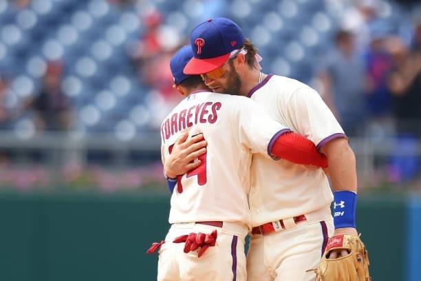 Ronald Torreyes and Bryce Harper of the Philadelphia Phillies hug after defeating the Atlanta Braves 2-1 in a game at Citizens Bank Park on July 25,...