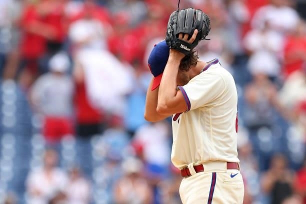 Pitcher Aaron Nola of the Philadelphia Phillies reacts after Austin Riley of the Atlanta Braves hit a home run with two outs in the ninth inning of a...
