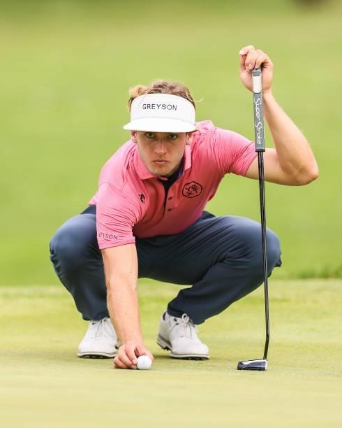James Nicholas lines up his putt on the 11th green during the final round of the Price Cutter Charity Championship presented by Dr. Pepper at...