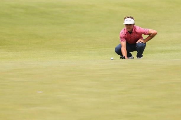 James Nicholas lines up his putt on the 16th green during the final round of the Price Cutter Charity Championship presented by Dr. Pepper at...