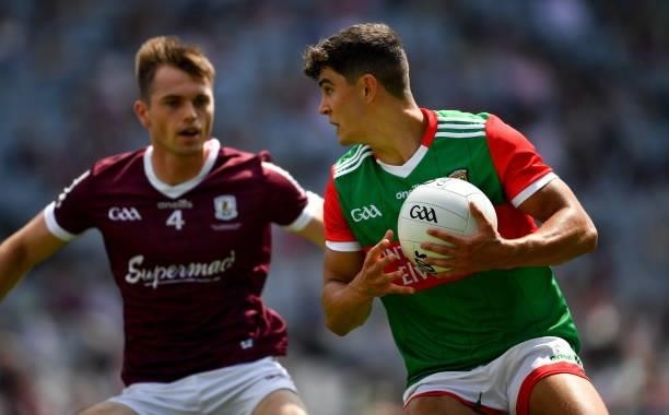 Dublin , Ireland - 25 July 2021; Tommy Conroy of Mayo in action against Liam Silke of Galway during the Connacht GAA Senior Football Championship...