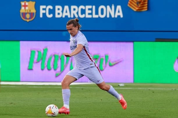 Antoine Griezmann of Barcelona runs with the ball during the pre-season friendly match between FC Barcelona and Girona FC at Estadi Johan Cruyff on...