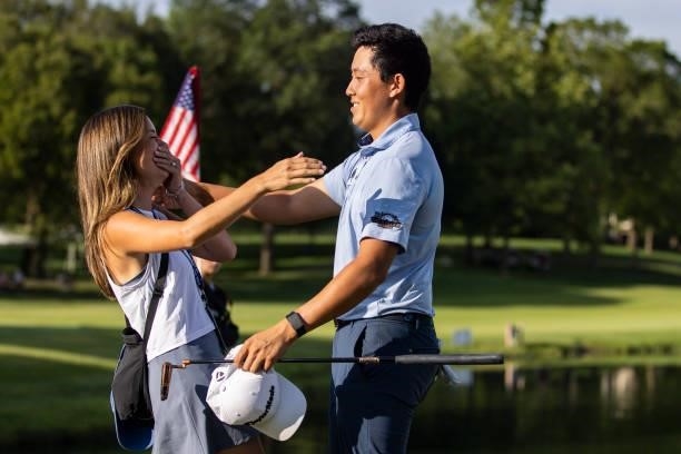 Dylan Wu Celebrates with his fiancé Margaret Burke on the 18th green after winning the final round of the Price Cutter Charity Championship presented...