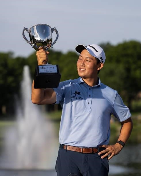 Dylan Wu Celebrates with the Trophy on the 18th green after winning the final round of the Price Cutter Charity Championship presented by Dr. Pepper...