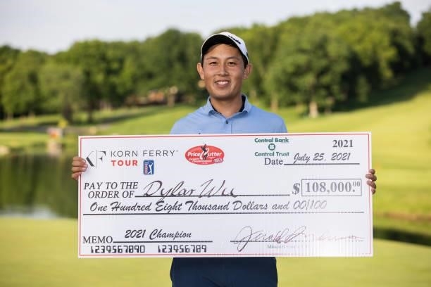 Dylan Wu poses with his Check on the 18th green after winning the final round of the Price Cutter Charity Championship presented by Dr. Pepper at...
