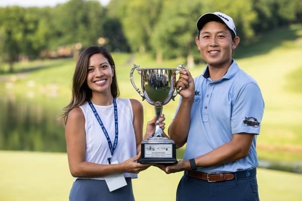 Dylan Wu poses for a photo with his fiancé Margaret Burke on the 18th green after winning the final round of the Price Cutter Charity Championship...