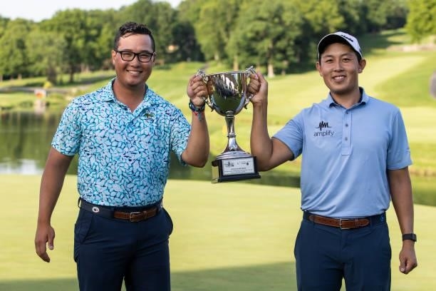 Dylan Wu poses for a photo with his caddie and younger brother Jeremy Wu on the 18th green after winning the final round of the Price Cutter Charity...