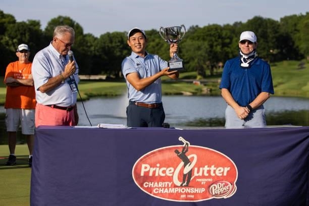 Dylan Wu poses with the Trophy on the 18th green after winning the final round of the Price Cutter Charity Championship presented by Dr. Pepper at...