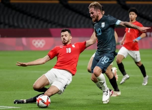 Spain's midfielder Dani Ceballos dribbles the ball while Egypt's defender Mahmoud El Wench attempts to stop him during the Tokyo 2020 Olympic Games...