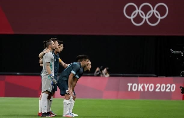 Argentina's starting players pose for a photo session prior to their Tokyo 2020 Olympic Games men's group C first round football match between Egypt...