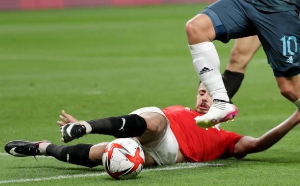 Egypt's defender Mahmoud El Wench slides to block Spain's midfielder Dani Ceballos's (L dribble during the Tokyo 2020 Olympic Games men's group C...