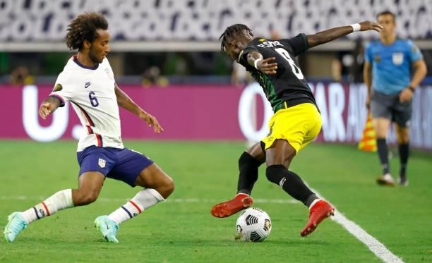 Gianluca Busio of the United States and Oniel Fisher of Jamaica fight for the ball in the first half of a 2021 CONCACAF Gold Cup Quarterfinals match...
