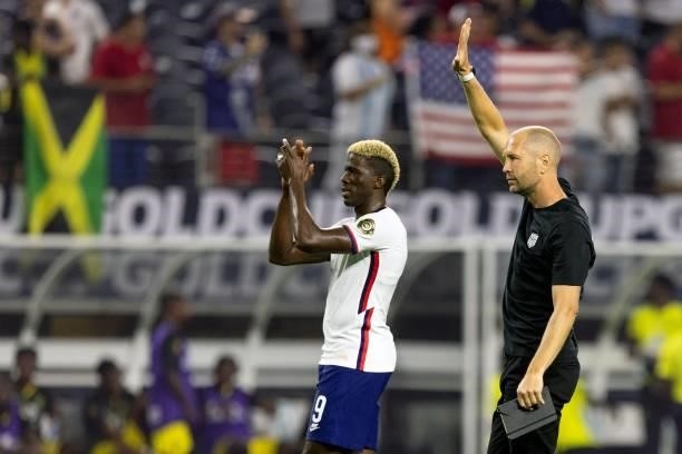S forward Gyasi Zardes and head coach Gregg Berhalter acknowledge fans as they celebrate after beating Jamaica 1-0 following the Concacaf Gold Cup...