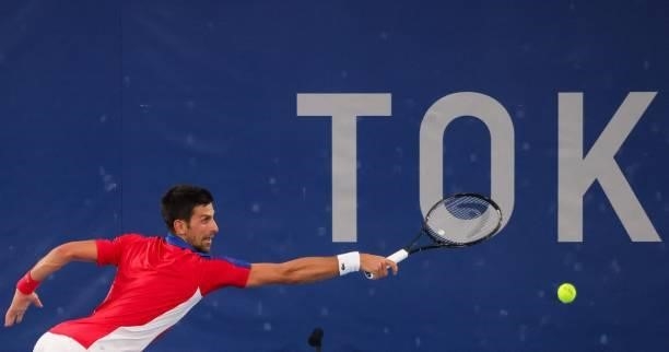 Serbia's Novak Djokovic returns a shot to Germany's Jan-Lennard Struff during their Tokyo 2020 Olympic Games men's singles second round tennis match...