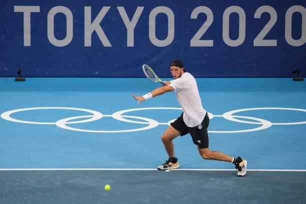 Germany's Jan-Lennard Struff returns a shot to Serbia's Novak Djokovic during their Tokyo 2020 Olympic Games men's singles second round tennis match...