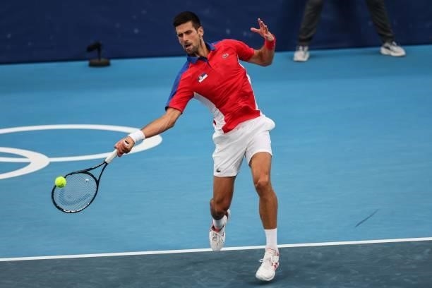 Serbia's Novak Djokovic returns a shot to Germany's Jan-Lennard Struff during their Tokyo 2020 Olympic Games men's singles second round tennis match...