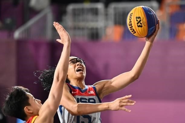 S Allisha Gray fights for the ball with China's Yang Shuyu during the women's pool round 3x3 basketball match between USA and China at the Aomi Urban...