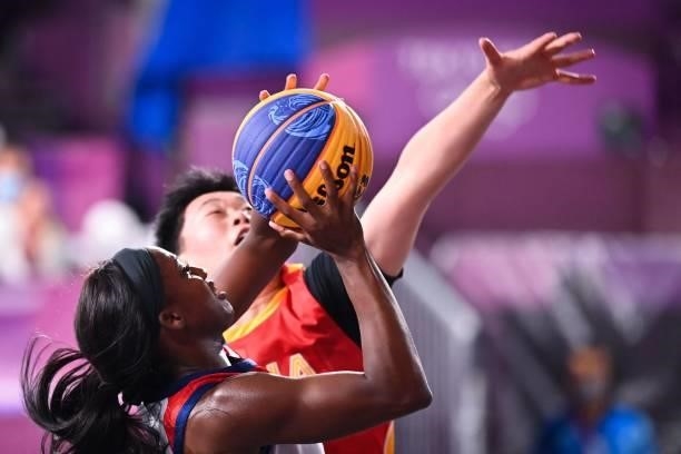 S Jacquelyn Young fights for the ball with China's Wan Jiyuan during the women's pool round 3x3 basketball match between USA and China at the Aomi...