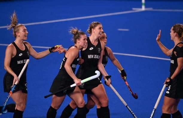 New Zealand's Olivia Merry celebrates with teammates after scoring against Japan during their women's pool B match of the Tokyo 2020 Olympic Games...
