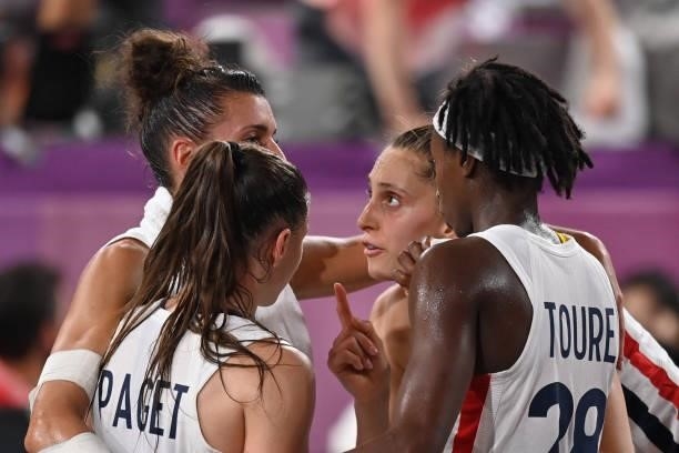 France's teammates react during the women's first round 3x3 basketball match between France and Russia at the Aomi Urban Sports Park in Tokyo, on...