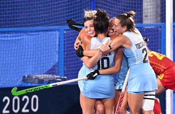 Players of Argentine celebrate after scoring against Spain during their women's pool B match of the Tokyo 2020 Olympic Games field hockey...