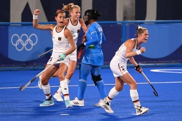 Germany's players celebrate after captain Nike Lorenz scored against India during their women's pool A match of the Tokyo 2020 Olympic Games field...