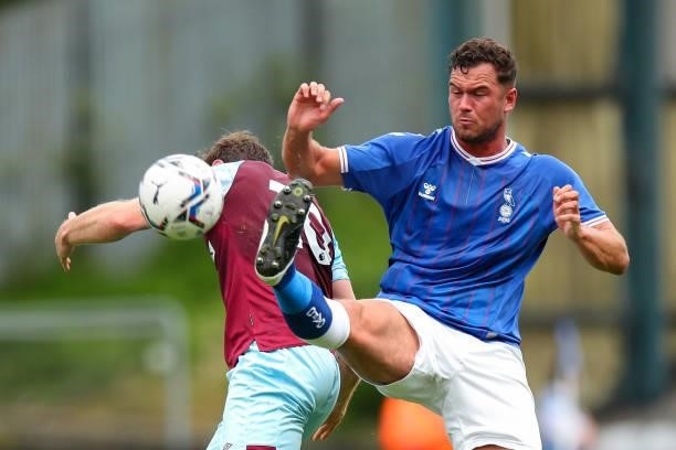 Harrison McGahey of Oldham Athletic and Ashley Barnes of Burnley during the Pre Season Friendly match between Oldham Athletic and Burnley at Boundary...