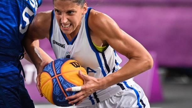 Italy's Chiara Consolini runs with the ball during the women's first round 3x3 basketball match between Italy and US at the Aomi Urban Sports Park in...