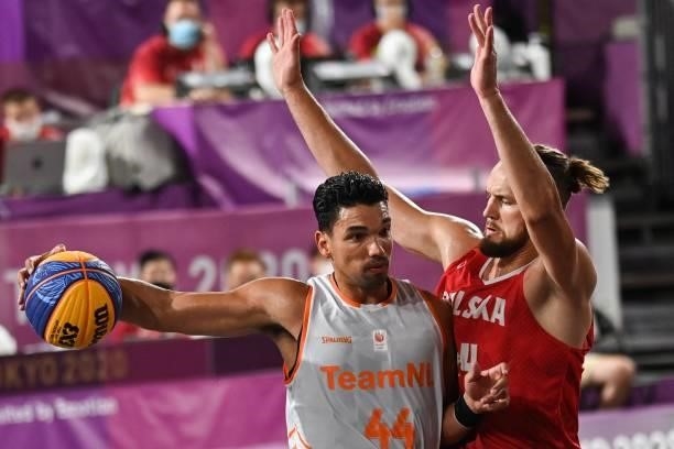 Netherlands' Arvin Slagter fights for the ball with Poland's Szymon Rduch during the men's first round 3x3 basketball match between Netherlands and...