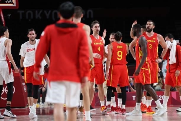 Spanish players celebrate after their win in the men's preliminary round group C basketball match between Japan and Spain during the Tokyo 2020...