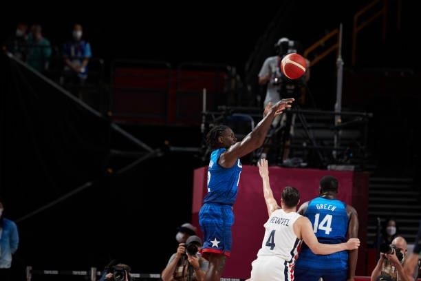 Jrue Holiday of USA battle for the ball on day two in the Men's First Round Group A match between France and USA at the Tokyo 2020 Olympic Games at...