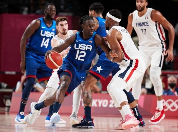 Jrue Holiday of USA battle for the ball on day two in the Men's First Round Group A match between France and USA at the Tokyo 2020 Olympic Games at...
