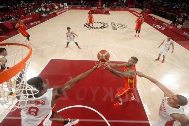 Spain's Willy Hernangomez Geuer fights for the ball with Japan's Rui Hachimura in the men's preliminary round group C basketball match between Japan...
