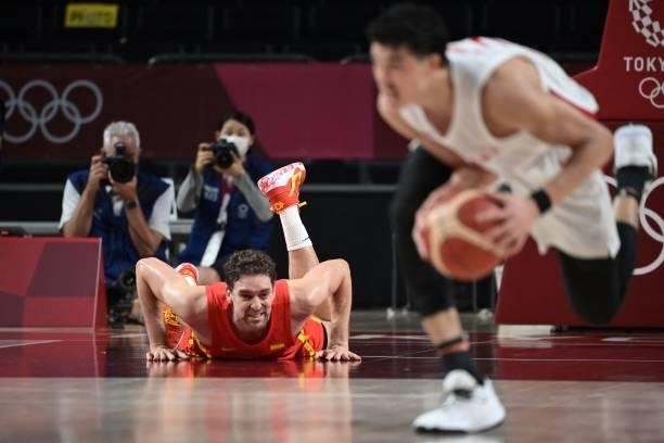 Spain's Pau Gasol Saez reacts after falling on the court during the men's preliminary round group C basketball match between Japan and Spain of the...