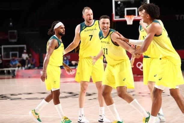 Dante Exum of the Australia Men's National Team celebrates with his teammates during the 2020 Tokyo Olympics on July 25, 2021 at Saitama Super Arena...