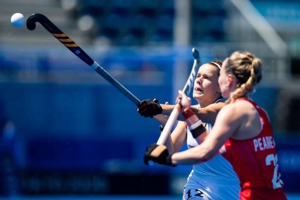 Charlotte Stapenhorst of Germany and Hollie Pearne-Webb of Great Britain compete on day two during the women's hockey group A preliminary round match...