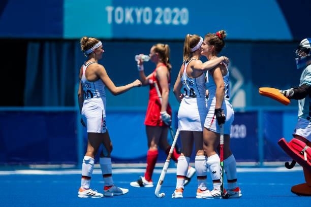Hanna Carina Granitzki of Germany, Pia Maertens of Germany and Sonja Zimmermann of Germany celebrate after the Match on day two during the women's...